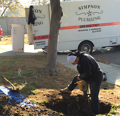 Simpson Plumbing employee performing a trenchless sewer repair in Manteca