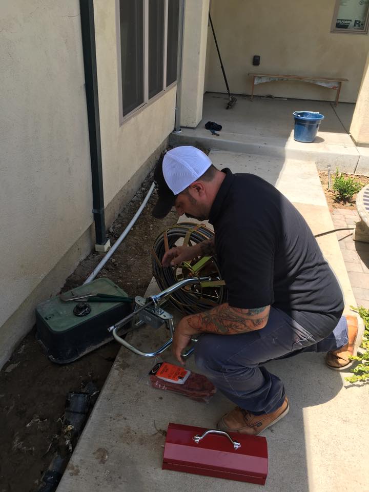 Plumber in Oakdale, CA snakes a drain