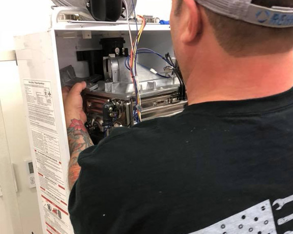 one of our experts is working on a commercial water heater repair