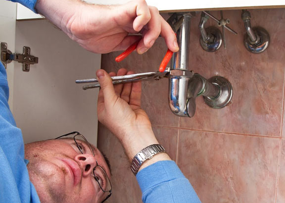 Tom working on a sink repair in Tracy, CA